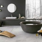 Artistic Bathrooms from Neutra with Stone Tub and Lounge Wooden Chair
