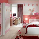 Girls Pink Badroom with Knick-Knacks and Red Rug