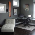 Awesome Corner Desk with Skis on the Wall and White Couch