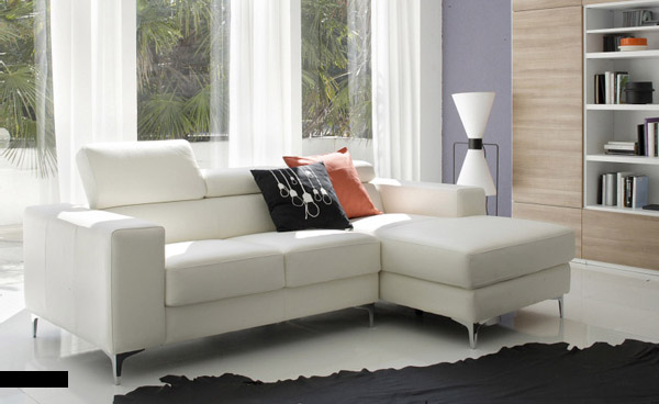 White Sofa and Natural Lit Living Room with Black Sofas