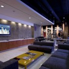 Modern Living Room TV Area Beside Gym Area