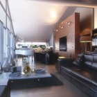 The Living Room Overall with Glass Wall and Long Black Leather Sofas