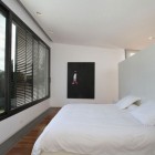 White Second Bedroom with Large Glass Window