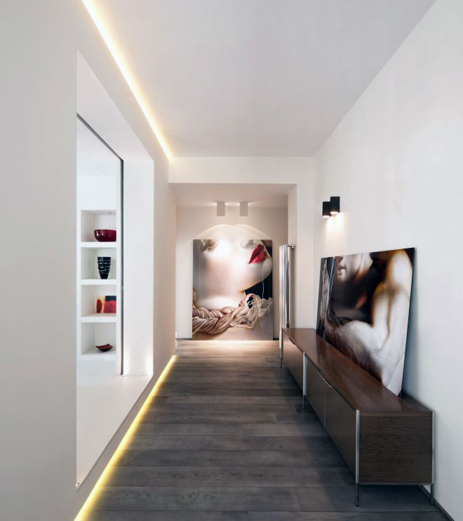 Modern Hallway with Recessed Wall Lighting and Wooden Floor