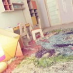 Cool Kids Bedroom with Colorful Rug and Yellow Chair