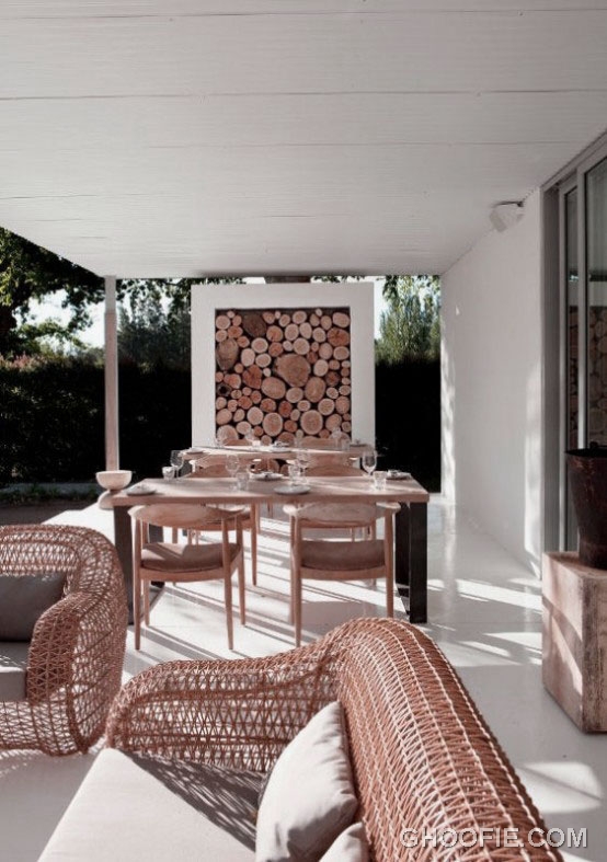 Elegant Patio Design with Rattan Chair and Outdoor Dining Table