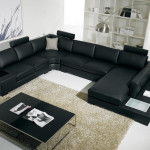 Black and white sectional sofa with table