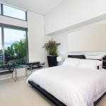 California master bedroom with white sheets