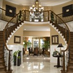 Glamorous entry way with double stairs